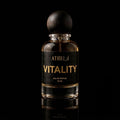 A 50 ml bottle of Athri Vitality Eau de Parfum with a dark wood-grain spherical cap, set against a solid black background with a subtle reflection below.