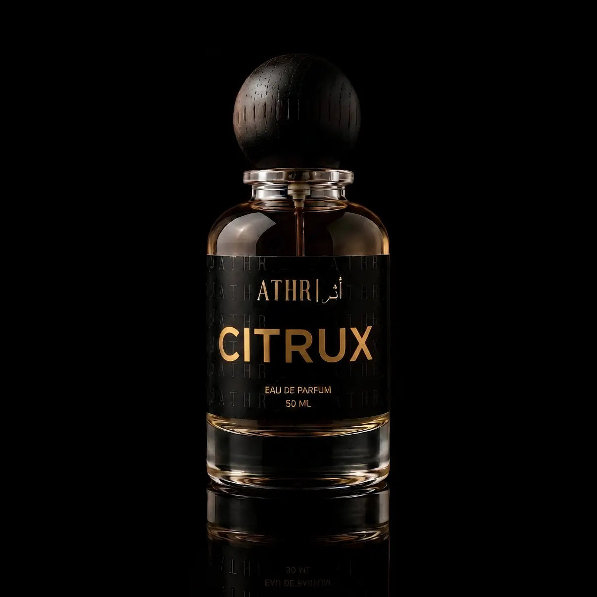 A 50 ml bottle of Athri Citrux Eau de Parfum with a black label and a dark wooden spherical cap, set against a solid black background with a subtle reflection below.