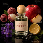 A clear glass perfume bottle with a round wooden stopper and a beige label reading 'ATHRI EMPRESS' is centered against a black background, surrounded by fragrance notes labeled Litchi, Red Apple, Violet, Italian Lemon, and Black Currant.