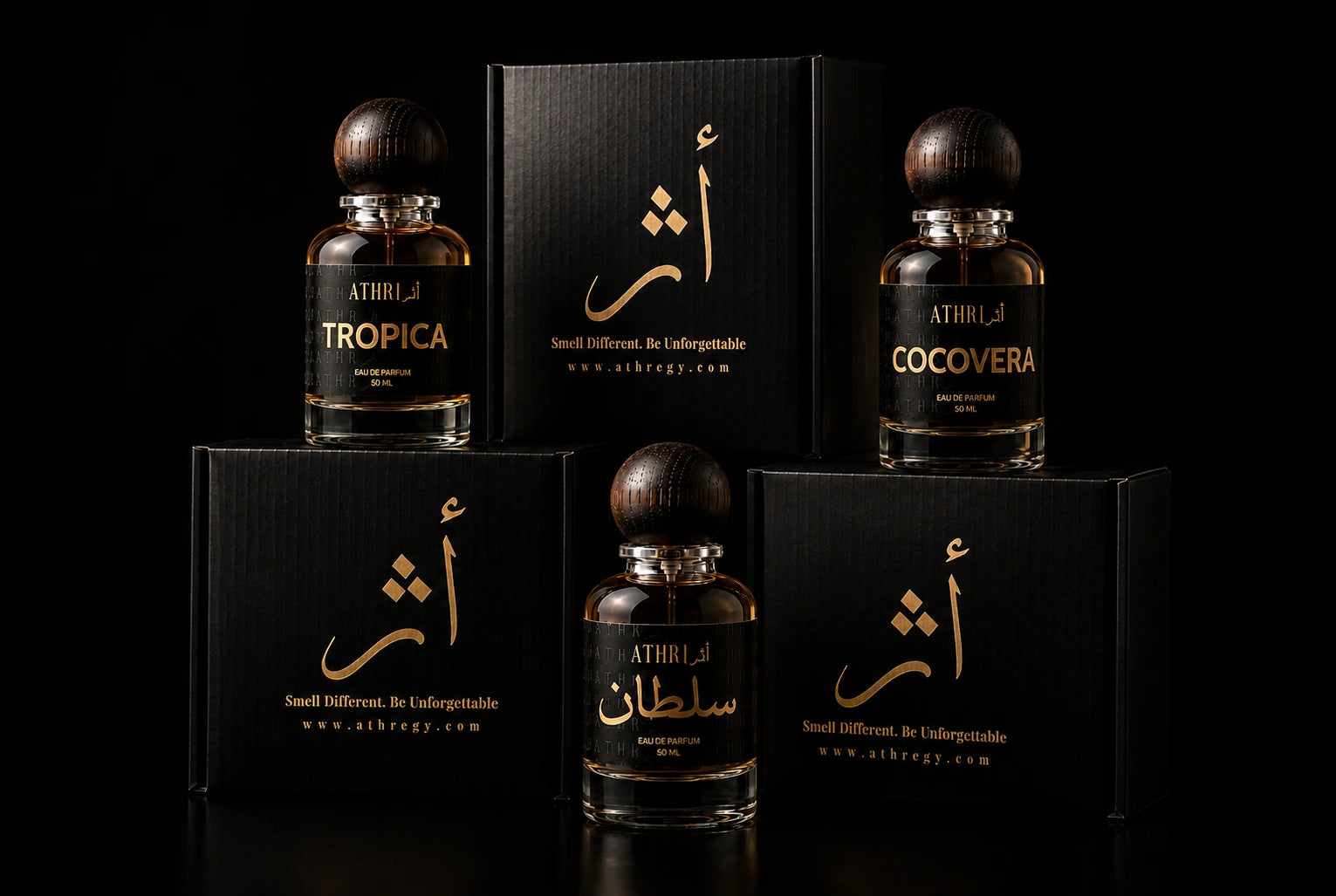 Five bottles of Athiri perfume with dark amber liquid and dark wood caps, arranged with their matching black boxes on a black background. The labels feature gold and white Arabic calligraphy and English names including Tropica, Cocovera, and Sultana.